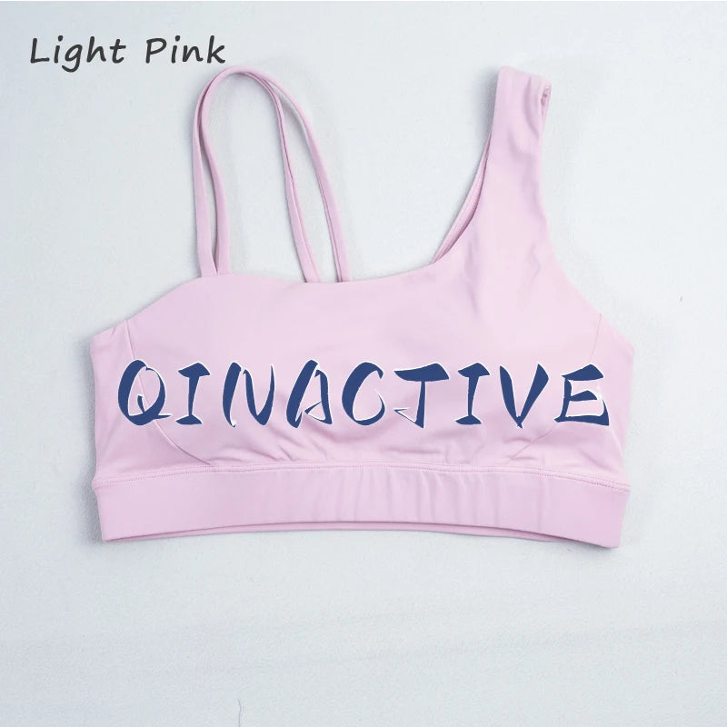 QINACTIVE Women's Sports Bra with Asymmetrical Shoulder Straps Yoga Top Removable Pads Beautiful Back Fitness Outfit Yoga Bra