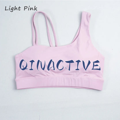 QINACTIVE Women's Sports Bra with Asymmetrical Shoulder Straps Yoga Top Removable Pads Beautiful Back Fitness Outfit Yoga Bra