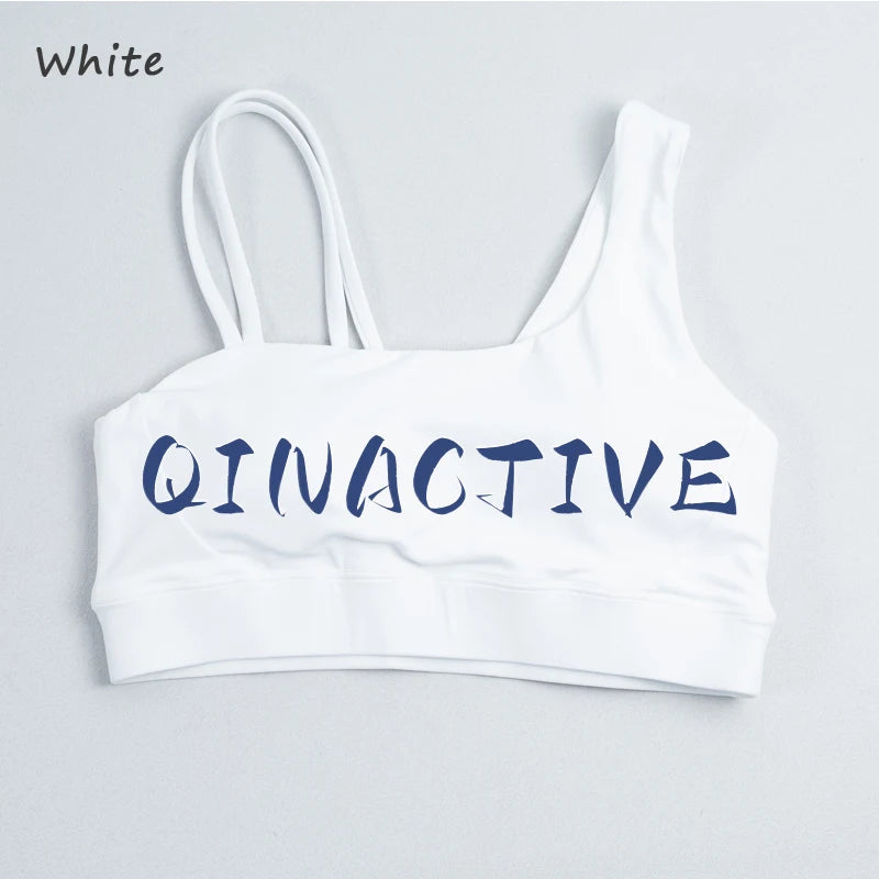 QINACTIVE Women's Sports Bra with Asymmetrical Shoulder Straps Yoga Top Removable Pads Beautiful Back Fitness Outfit Yoga Bra