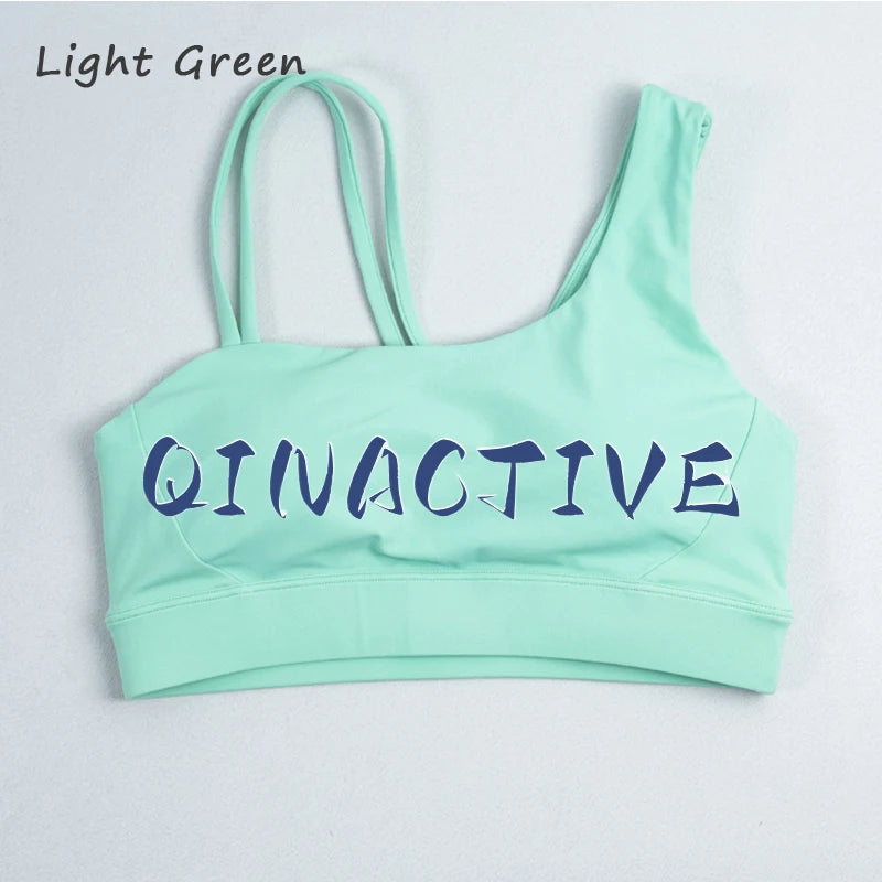 QINACTIVE Women's Sports Bra with Asymmetrical Shoulder Straps Yoga Top Removable Pads Beautiful Back Fitness Outfit Yoga Bra